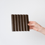 NU Wall Arc Reeded Warm Oak wall panel sample showcasing textured wood grain and warm oak finish for interior decor.