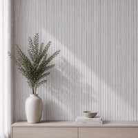 NU Wall Luxe White Washed Travertine Reeded Panel wall panel with textured, white washed travertine surface and reeded design.