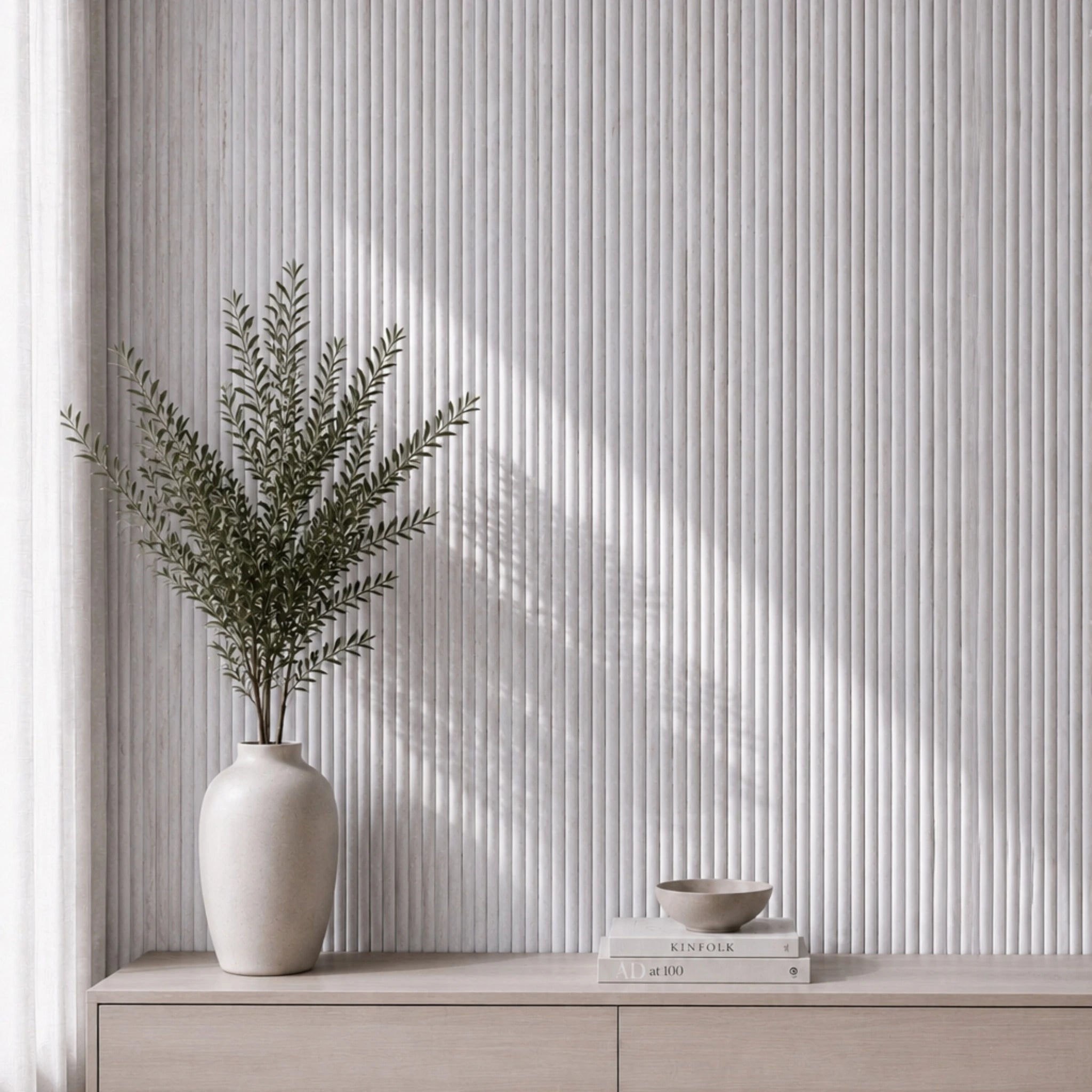 NU Wall Luxe White Washed Travertine Reeded Panel wall panel with textured, white washed travertine surface and reeded design.