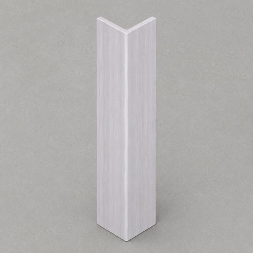 White washed travertine corner trim by NU Wall, showcasing smooth, polished surface and clean edge for wall finishing.