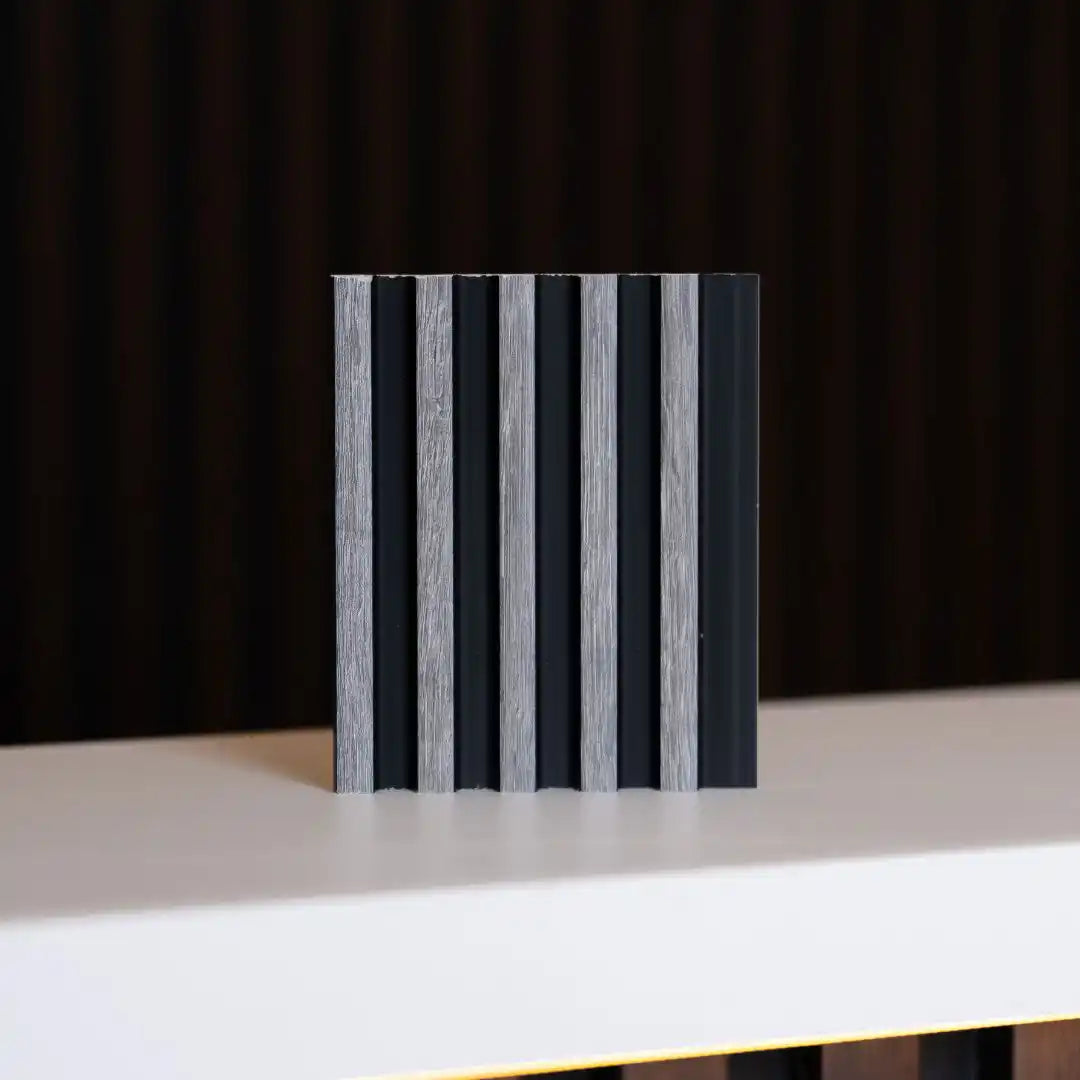 NU Wall Palm Grey Oak and Black small slatted wall panel sample showing textured wood grain and modern design.