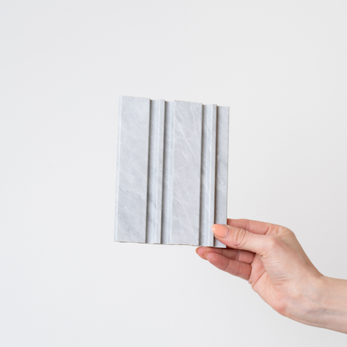 NU Wall Dubai Cloudy Grey slatted wall panel sample showing textured grey wood finish and modern design for interior decor.