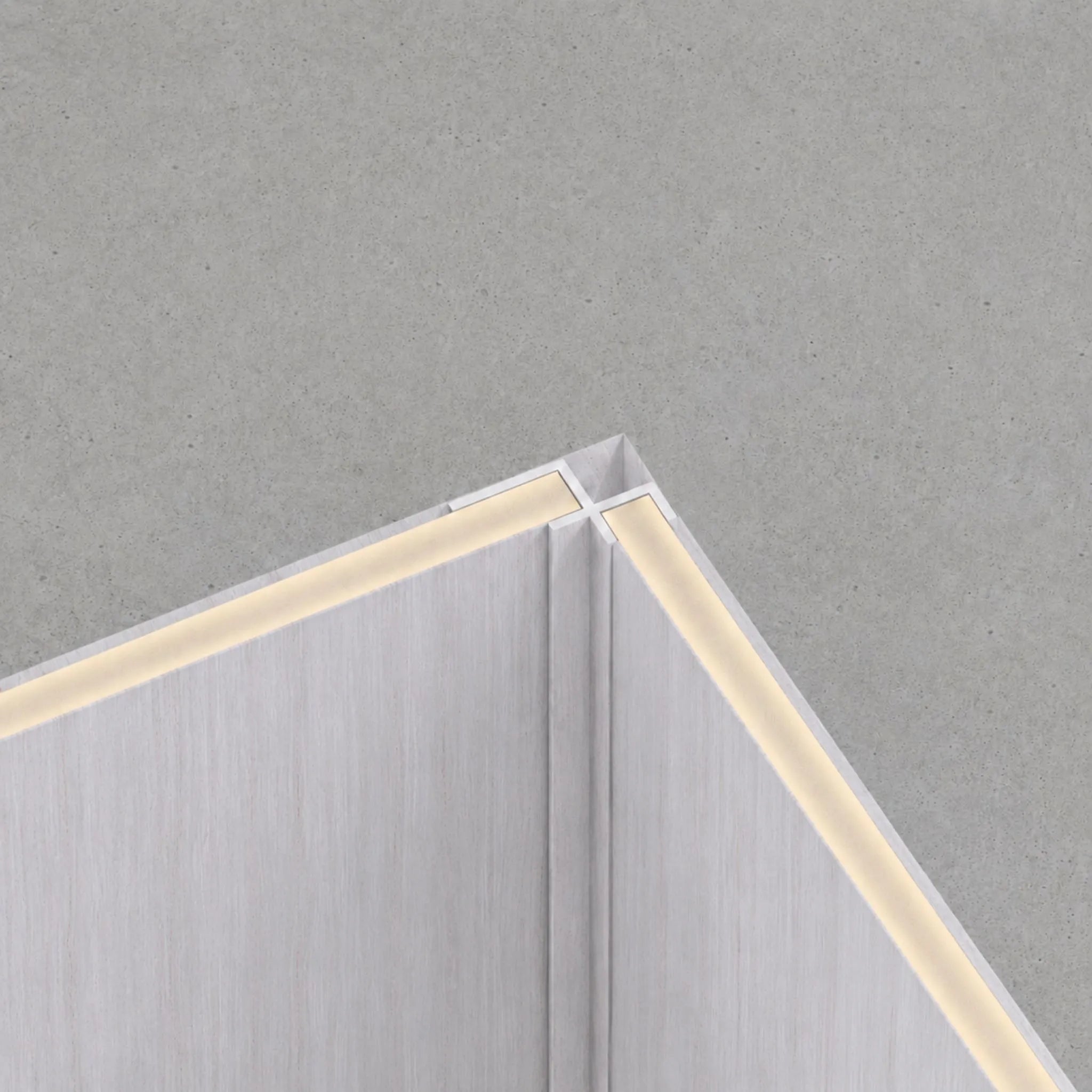 White washed travertine internal corner trim by NU Wall, WPC joint trim for seamless wall finishing and elegant interior detail.