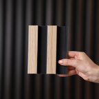 NU Wall Residence Light Oak and Black Slatted Wall Panel Sample showing textured wood and black slats for modern interior design.