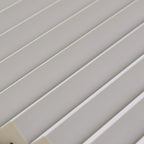 Set of four NU Wall Elegance Cascade paintable wall panels with intricate geometric designs for modern interior decor.