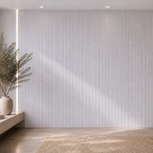 Luxe white washed travertine fluted wall panel by NU Wall, showcasing textured, carved surface with vertical grooves for interior decor.