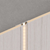 White washed travertine LED joint trim for WPC joints, by NU Wall, showcasing a sleek, modern finish for wall and flooring edges.