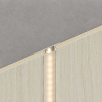NU Wall LED joint trim in cool beige travertine, WPC joint trim for seamless wall and flooring edges, showcasing textured surface.