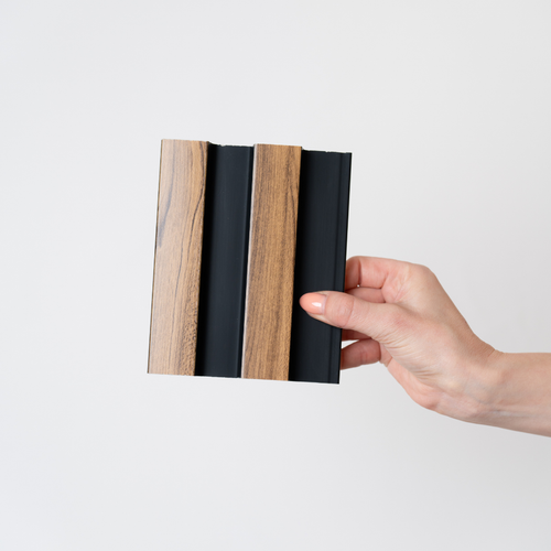 NU Wall Residence medium oak and black slatted wall panel sample showing wood grain and black slatted design on a neutral background.