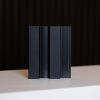 NU Wall Residence brushed black slatted wall panel sample showing textured black wood slats for modern interior decor.