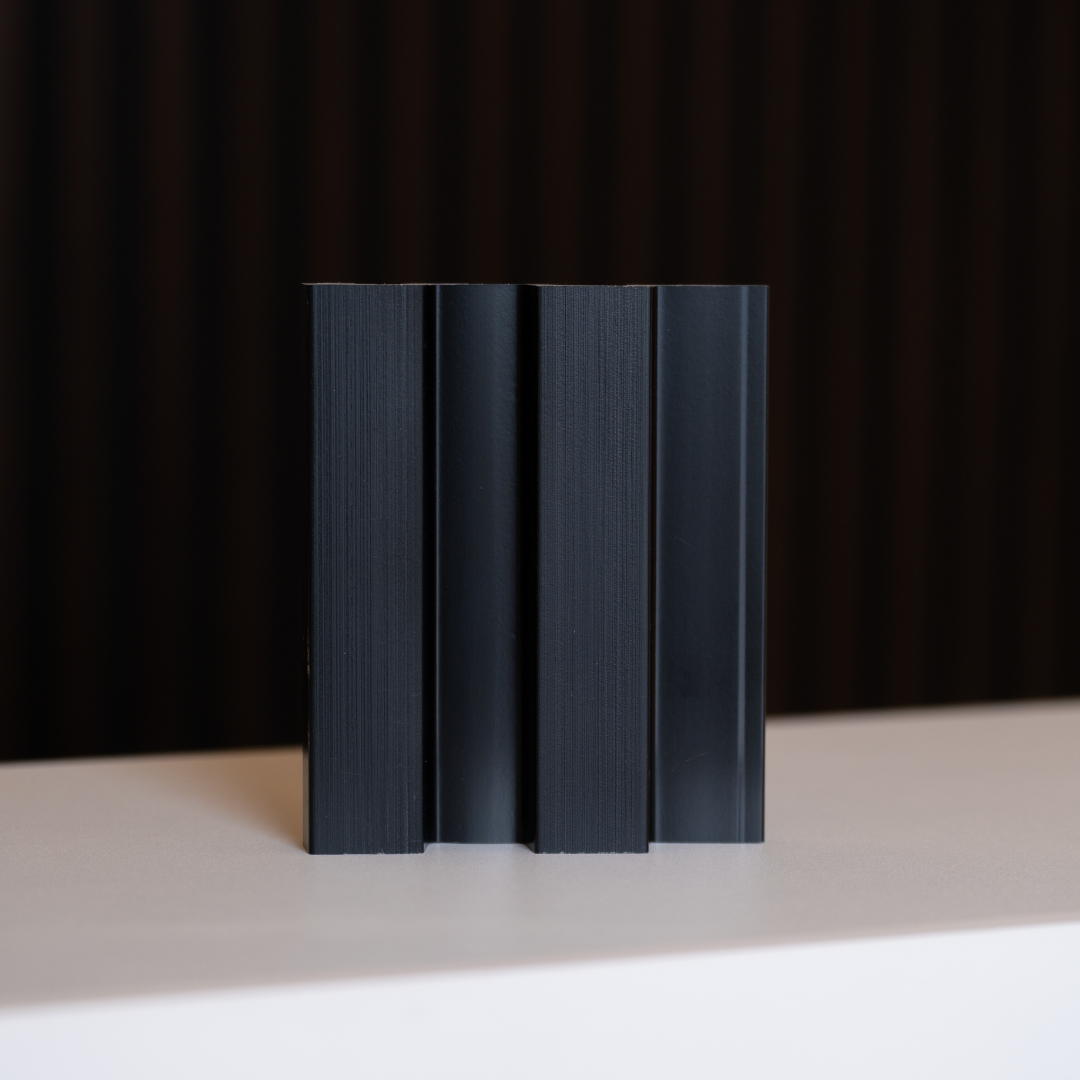 NU Wall Residence brushed black slatted wall panel sample showing textured black wood slats for modern interior decor.