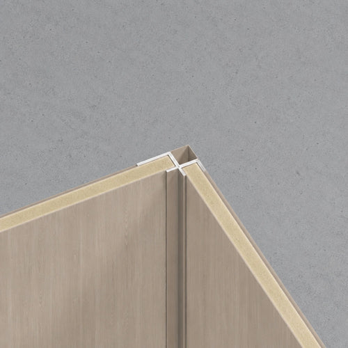 NU Wall Mink Oak WPC joint trim used as an internal corner trim with a natural wood finish for seamless wall edges.