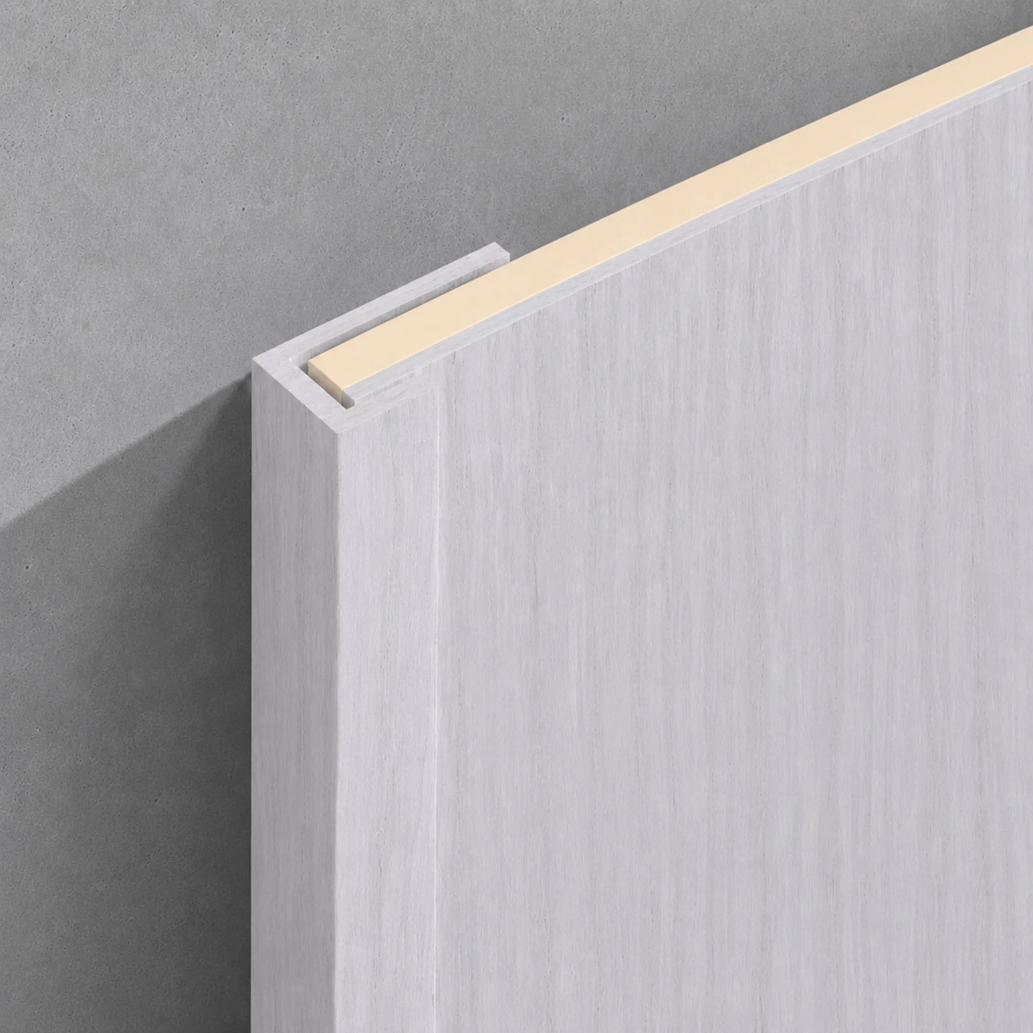 White washed travertine end trim from NU Wall's WPC joint trims collection, showcasing a smooth, natural stone finish.