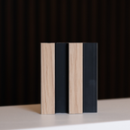 NU Wall Residence light oak and black slatted wall panel sample showing modern wood and black slat design.