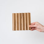 NU Wall Arc Reeded Medium Oak Wall Panels showing textured wood grain and reeded design, pack of four for wall decoration.