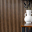Set of four NU Wall Arc Reeded Warm Oak wall panels showing textured wood grain and reeded design for interior decor.