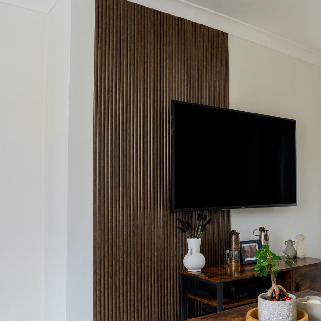Set of four NU Wall Arc Reeded Warm Oak wall panels showcasing textured wood grain and elegant reeded design.